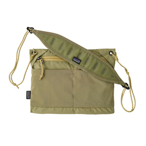Gumtree Green Patagonia Terravia Sacoche crossbody bag with a logo on the shoulder strap against a white background.