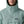 Person wearing khakis and a Patagonia Funhoggers Anorak Pullover in thermal blue featuring a hood on a white background.