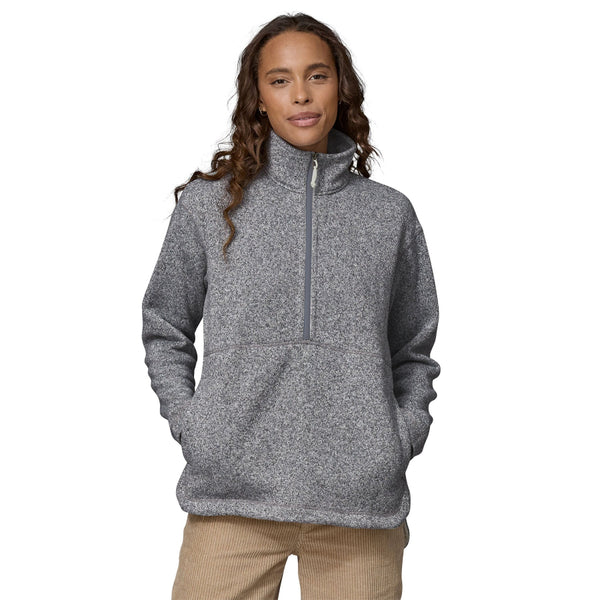 Person wearing the Patagonia Women's Better Sweater Oversized Pullover in gray color with a half-zip front, stand-up collar, and a marsupial pocket on a white background.