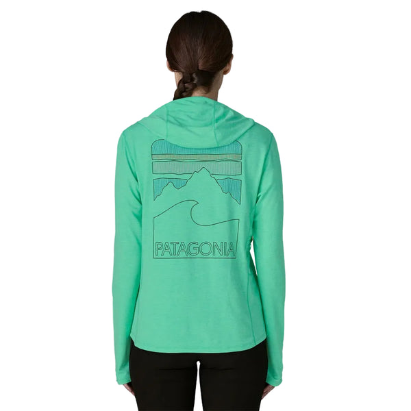 Person wearing a green Patagonia Women's Capilene Cool Sun Hoody with a mountain design on the back against a white background.