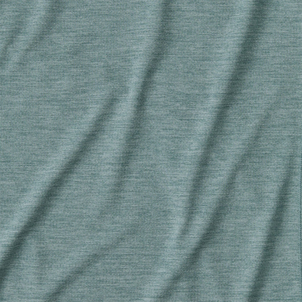 Close up of the fabric texture of the nouveau green and sage blue x-dye Patagonia Women's Capilene Cool Sun Hoody.