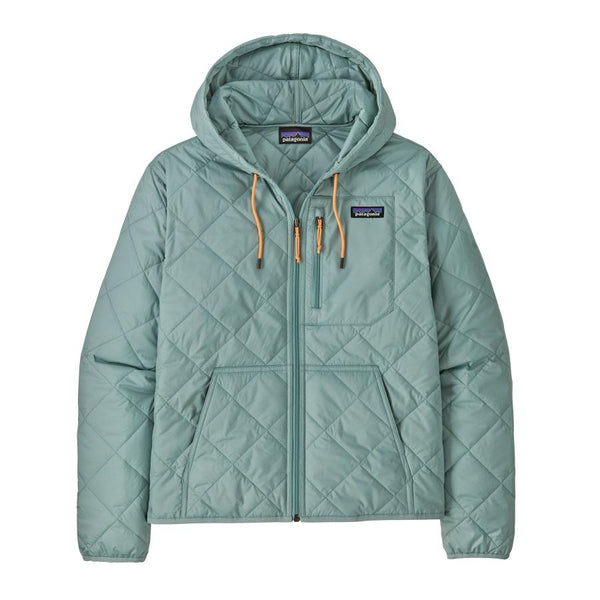 front view of a light blue quilted women's patagonia hooded bomber jacket on a white background