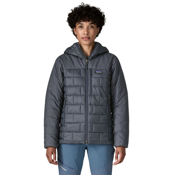 Person wearing the new for 2025 Patagonia Women's Hi-Loft Nano Puff Hoody in smolder blue on a white background.
