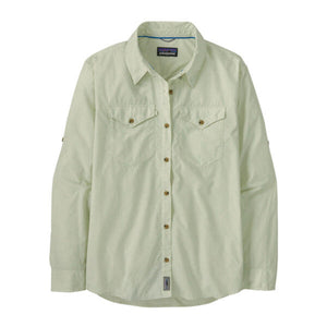 A long-sleeved, button-up, light green Patagonia Women's Sun Stretch Shirt with chest pockets and collar snaps, on a white background.