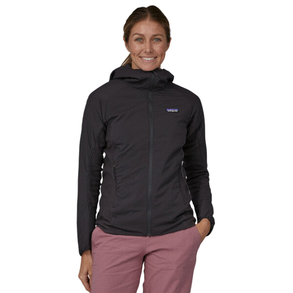 Woman wearing a black Patagonia Women's Nano Air Light Hybrid Jacket on a white background.