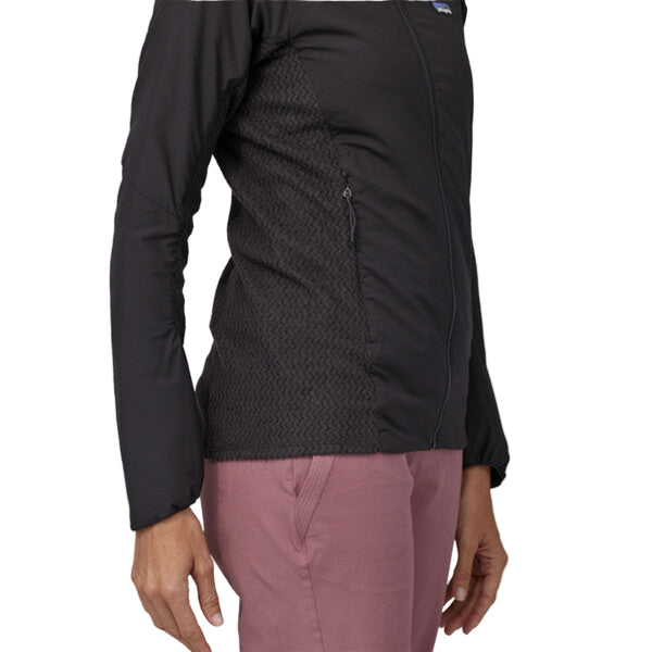 Woman wearing a black Patagonia Women's Nano Air Light Hybrid Jacket showing the side details on a white background.