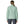 Person wearing grey pants and the thin ice color Patagonia Women's Nano Puff Jacket on a white background.