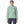Person wearing grey pants and the thin ice color Patagonia Women's Nano Puff Jacket on a white background.