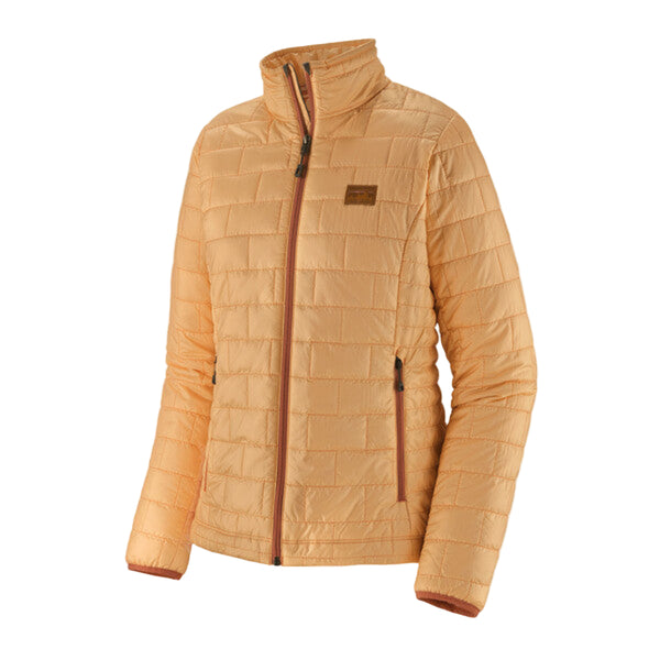 A Patagonia Women's Nano Puff Jacket in sand melon color, featuring a quilted pattern and zippered pockets, on a white background.