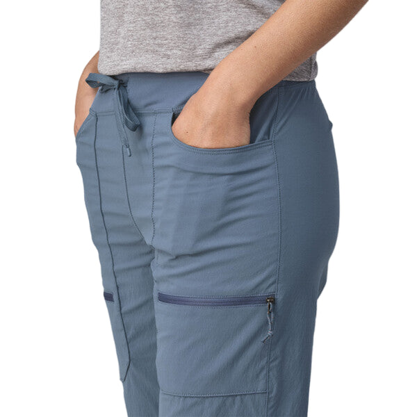 Person wearing Patagonia Women's Quandary Joggers in blue, featuring pocket details, on a white background.