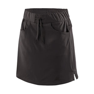 Front view of the patagonia women's tech skort in black showing pocket and drawstring waist details on a white background.