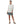 A smiling woman wearing a white shirt and the patagonia women's tech skort in nouveau green showing fit and form, on a white background.