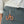 Front view of the patagonia women's tech skort in nouveau green showing pocket and tool loop details with a set of hemostats clipped on.