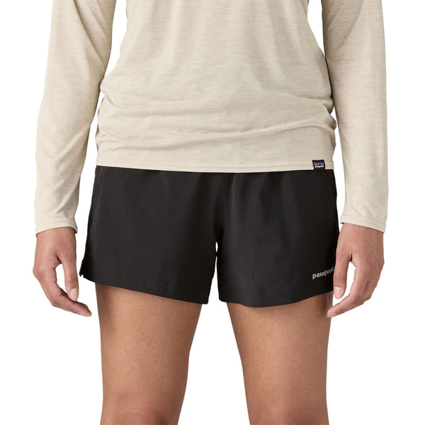 Person wearing black Patagonia Women's Terrebonne Shorts with a visible brand logo on a white background.