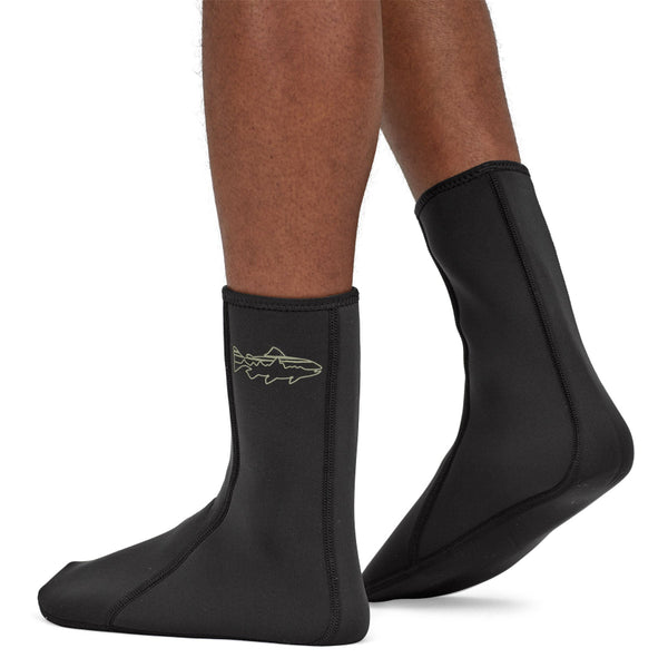 Person wearing black neoprene Patagonia Yulex Wading Socks on a white background.