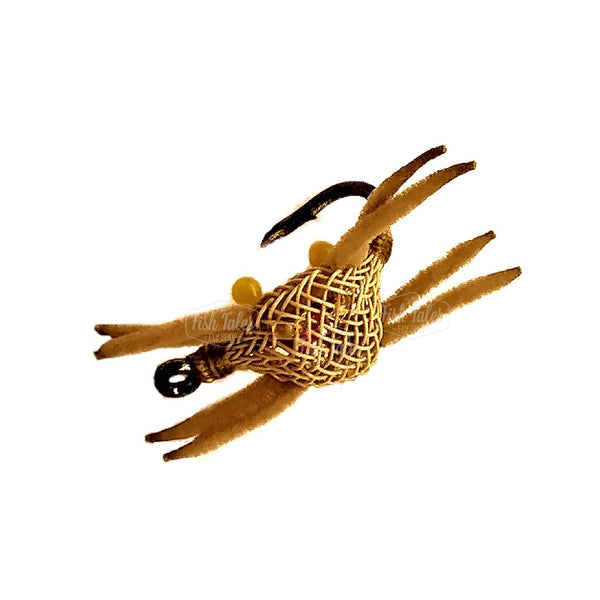 Saltwater Flexo Crab fly with tan flexo body, tan chenille legs and yellow eyes on a white background.