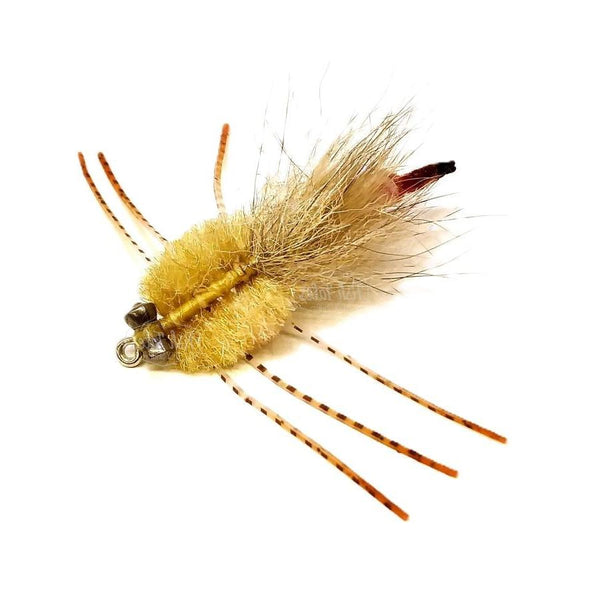 Saltwater Strong Arm Crab fly with tan fiber body, tan chenille strong arm, and barred orange fire tip sili legs on a white background.