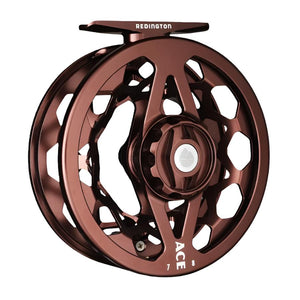 Tobacco brown Redington Ace Fly Reel showing the side with drag knob on a white background.