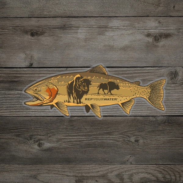 A Rep Your Water Bison Trout Sticker, featuring a cutthroat trout and bison inset graphic, on a wood grain background.