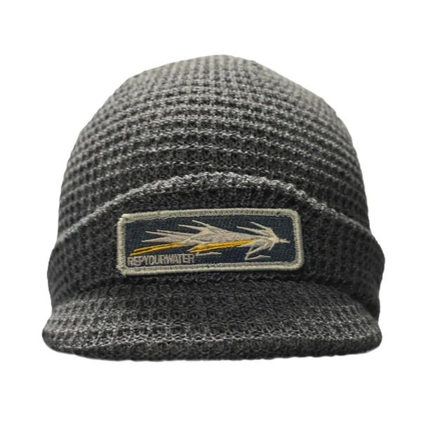 Grey knit beanie with a brim and with a Rep Your Water Prime Cuts patch on a white background.
