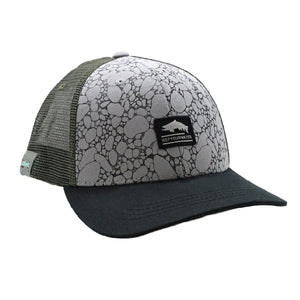 A standard fit Rep Your Water River Rock Trout Badge Trucker hat with a dark grey brim and olive green mesh and trout silhouette patch on the front, against a white background.