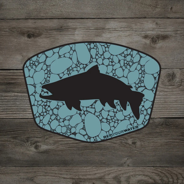 A Rep Your Water River Rock Trout Sticker, featuring a trout silhouette over river rock in blue, on a wood grain background.