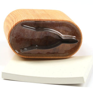 A River Road Creations Saltwater Gurgler Foam Body Cutter shown with the cutting pad, on a white background.