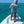 Person fly fishing on a flats skiff in tropical waters, using the SA Launch Pad Casting Mat to catch fly line coils.