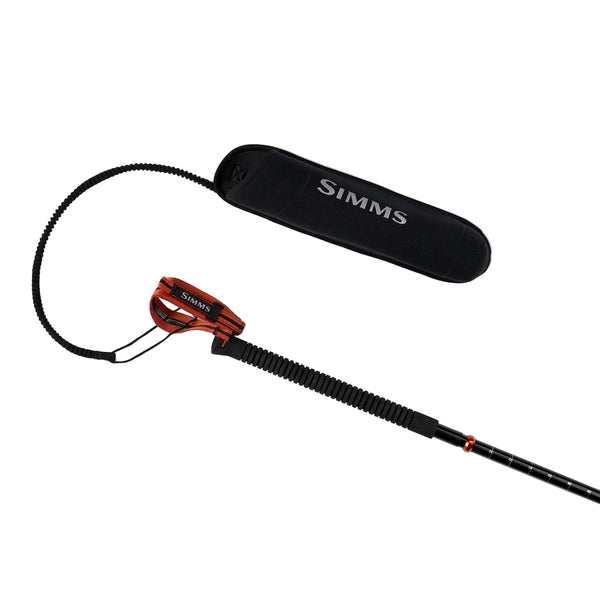 Handle and top section of the black and orange Simms Aluminum Wading Staff with black sheath and lanyard on a white background.