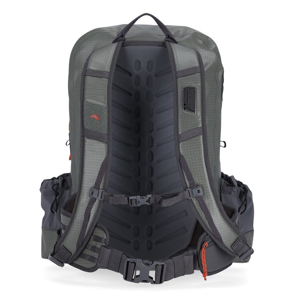 Back side of the olive and grey Simms Dry Creek Z Waterproof Backpack, showing the side bottle pockets, shoulder straps, and waist support strap, against a white background.