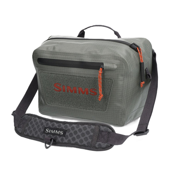 Olive green Simms Dry Creek Z Waterproof Waist Pack, showing the Simms logo on the front pocket, waterproof zippers, and optional neck strap, against a white background.
