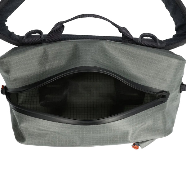 Overhead view of the interior of the steel grey Simms Dry Creek Z Waterproof Waist Pack, showing the waterproof zipper, against a white background.