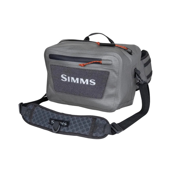 Steel grey Simms Dry Creek Z Waterproof Waist Pack, showing the Simms logo on the front pocket, waterproof zippers, and optional neck strap, against a white background.