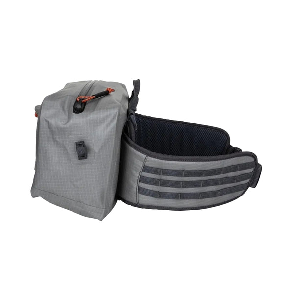 Side view of the steel grey Simms Dry Creek Z Waterproof Waist Pack, showing the tactical webbing on waist strap, against a white background.