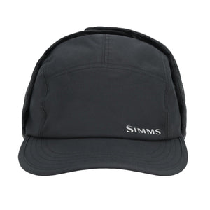 Black waterproof Simms ExStream Cap with ear flaps on a white background.