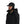 Man wearing a black hooded jacket and black waterproof Simms ExStream Cap with ear flaps on a white background.