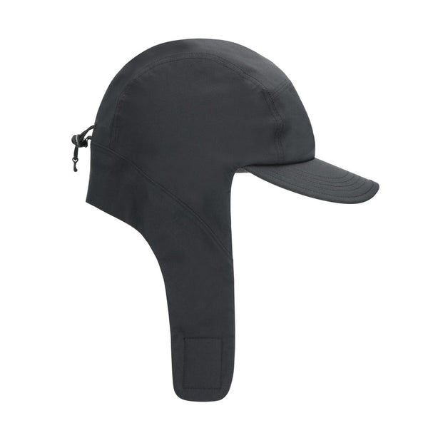 Black waterproof Simms ExStream Cap with ear flaps on a white background.