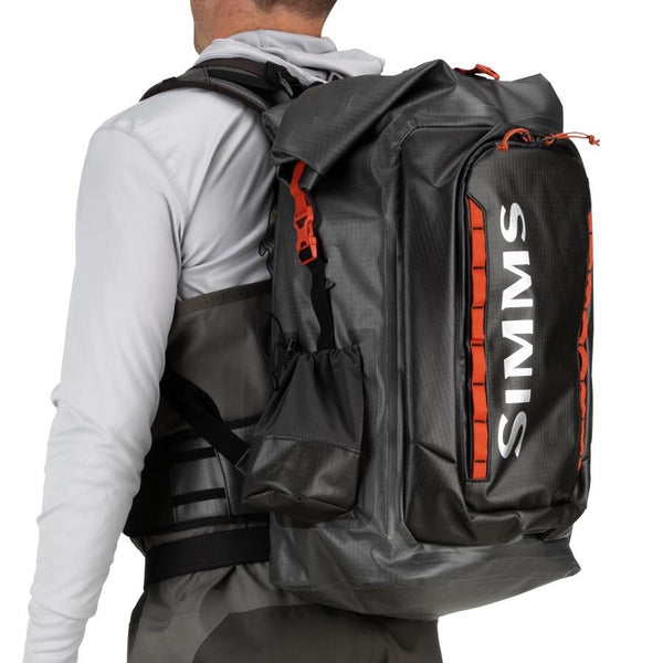 Person wearing the grey Simms G3 Guide Rolltop Backpack on a white background.