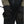 Person in coveralls wearing a pair of black Simms Guide Insulated gloves on a white background