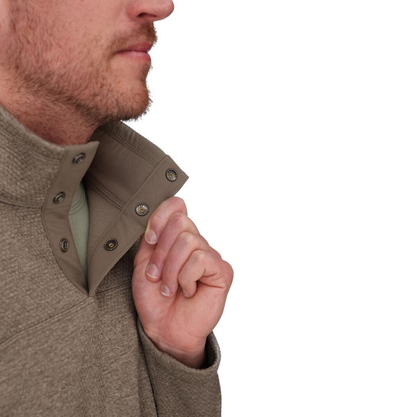 Close-up of the collar on a Simms Men's Harbor Sweater in sturgeon heather on a person over a white background.