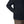 A person wearing a black Simms Men's Harbor Shacket showing the side pocket details on a white background.