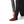 Person wearing the black Simms Men's Strata 330 Fleece Bottoms showing cuff detail on a white background.