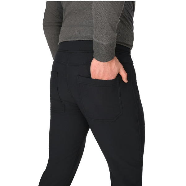 Person wearing the black Simms Men's Strata 330 Fleece Bottoms showing pocket detail on a white background.