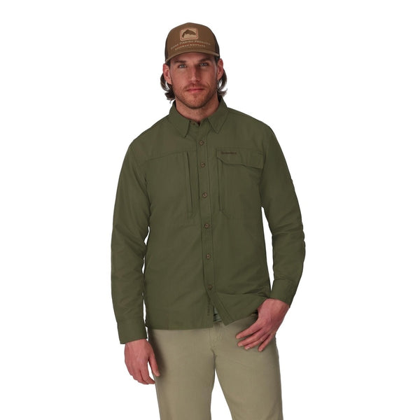 A man wearing long-sleeved loden green Simms men's UPF guide shirt with tan pants and a brown ball cap facing front on a white background.
