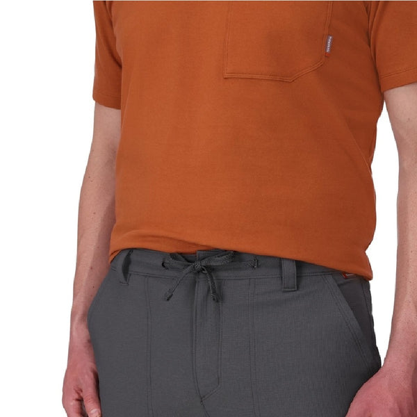 Person wearing the Simms Men's Wanaka Quick Dry Pant in Slate showing the waistband details on a white background.
