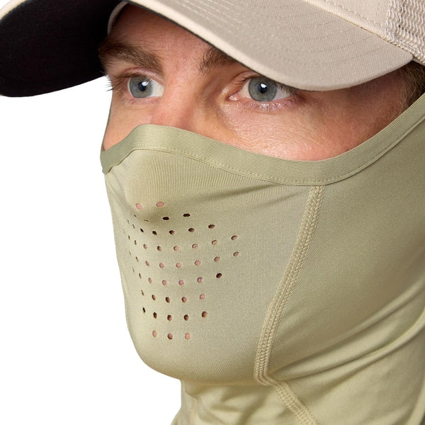Close up of a person wearing a tan ball cap and the Simms SolarFlex UPF 50+ SunGaiter in pale pine green showing the vents in portion covering face, on a white background.