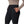 Person wearing the black Simms Women's Strata 330 Fleece Bottoms showing pocket detail on a white background.