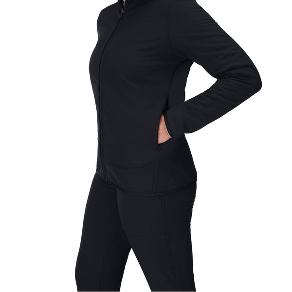 Person wearing the Black Simms Women's Strata 330 Full Zip Fleece Hoody and Pants showing pocket detail on a white background.