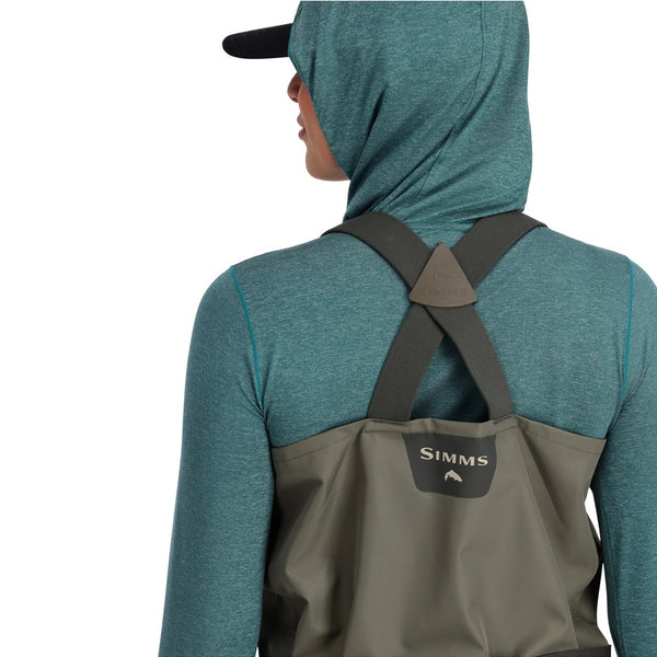 Back view of a person wearing Simms Women's Tributary Stockingfoot Waders zoomed in on the crossover shoulder strap details on a white background.