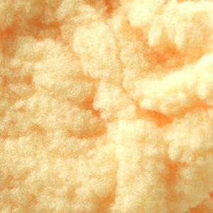Close up of Textreme Eggstasy Fly Tying Egg Yarn in fluorescent peach.